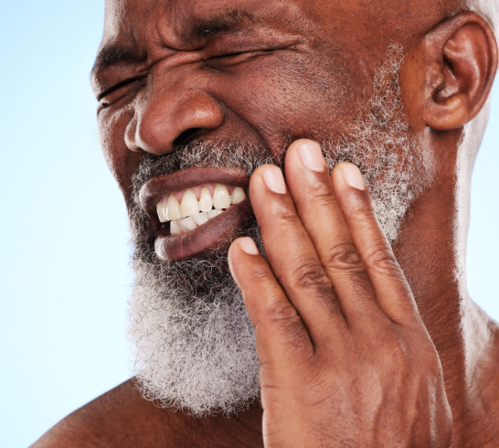 Toothache, pain or elderly black man in studio with discomfort, stress or dental emergency. Senior person, medical insurance or exposed nerve on blue background for healthcare, infection or damage